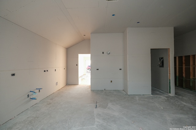 empty room with lofted ceiling