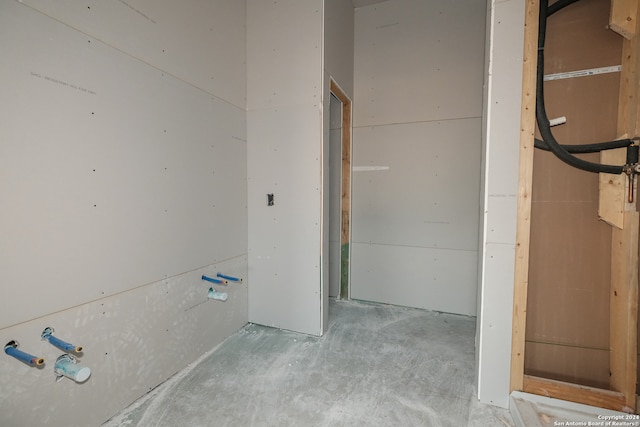 bathroom with concrete flooring