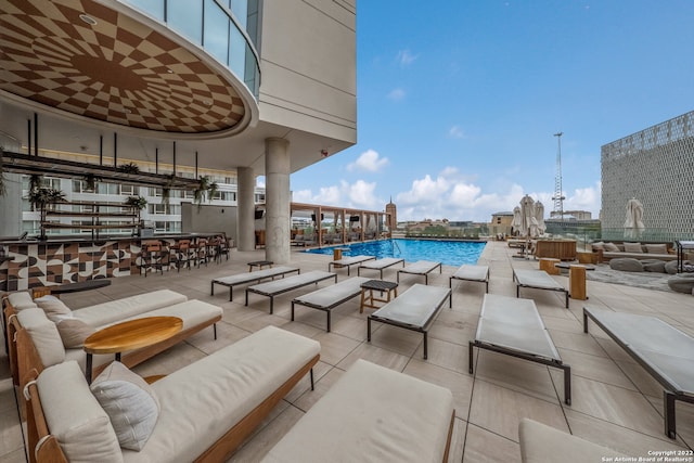 view of pool featuring outdoor lounge area and a patio area