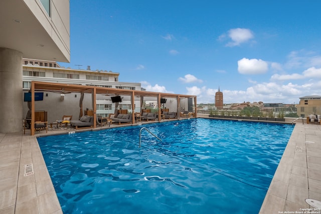 view of swimming pool with outdoor lounge area and a patio area