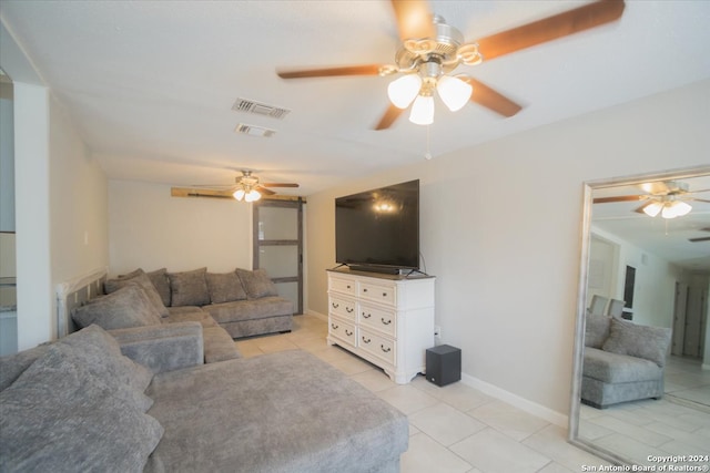 living room featuring ceiling fan and light tile patterned floors