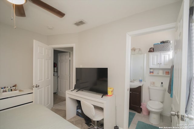 bedroom featuring light tile patterned floors, sink, and ceiling fan