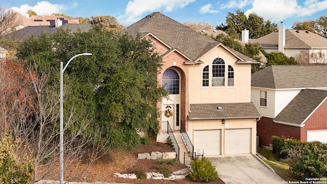 view of front of property with a garage