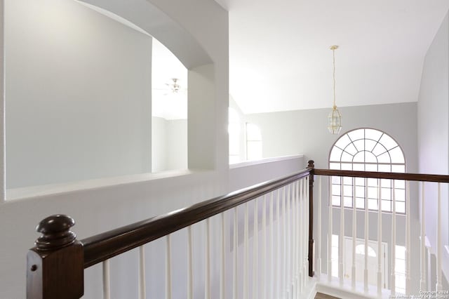 corridor with lofted ceiling