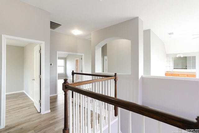 hall with light hardwood / wood-style floors