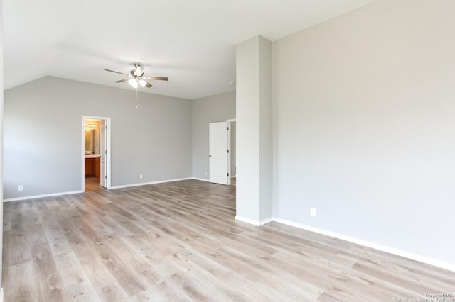 spare room featuring light hardwood / wood-style floors, ceiling fan, and lofted ceiling