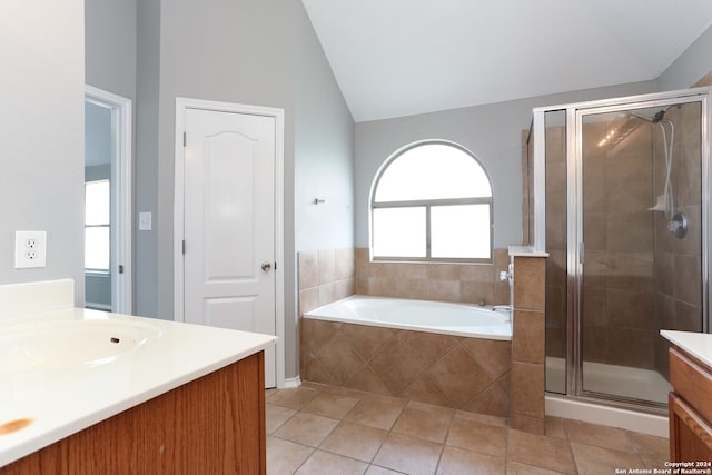 bathroom featuring tile patterned flooring, plenty of natural light, vanity, and shower with separate bathtub