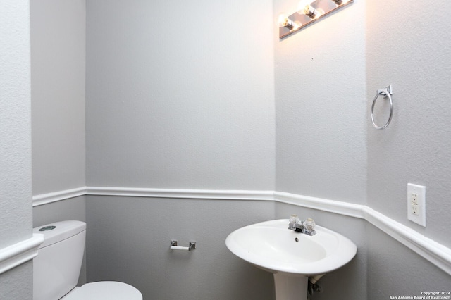 bathroom with sink and toilet