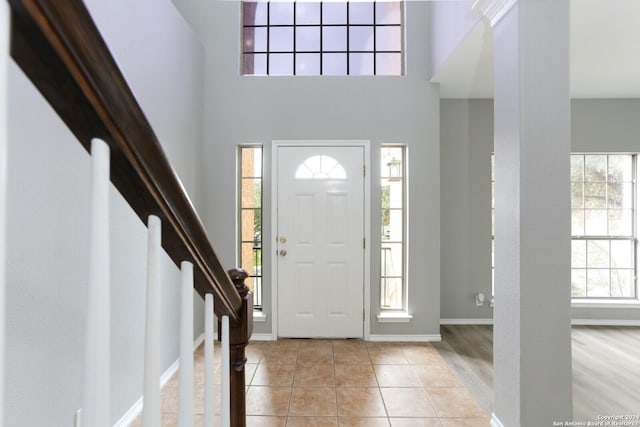 tiled foyer entrance with a high ceiling