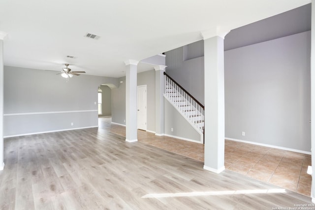 unfurnished living room with ceiling fan and light hardwood / wood-style floors