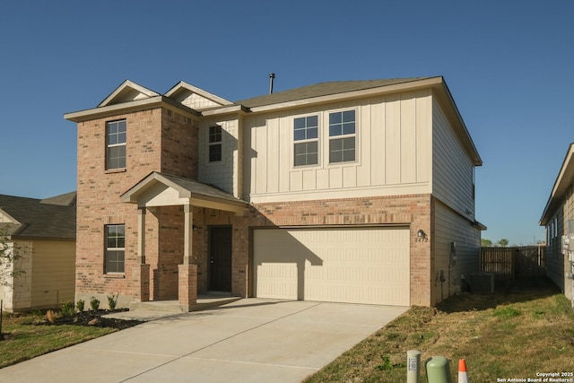 traditional-style house with board and batten siding, concrete driveway, a garage, and brick siding