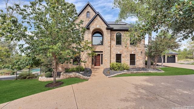 view of front of home with a garage and a front yard