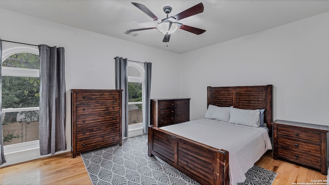 bedroom featuring light wood-type flooring and ceiling fan