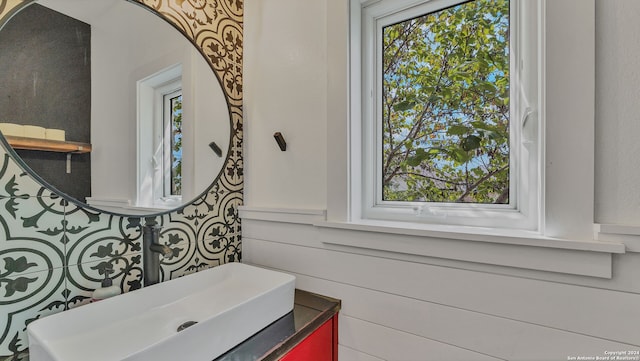 bathroom with vanity and plenty of natural light