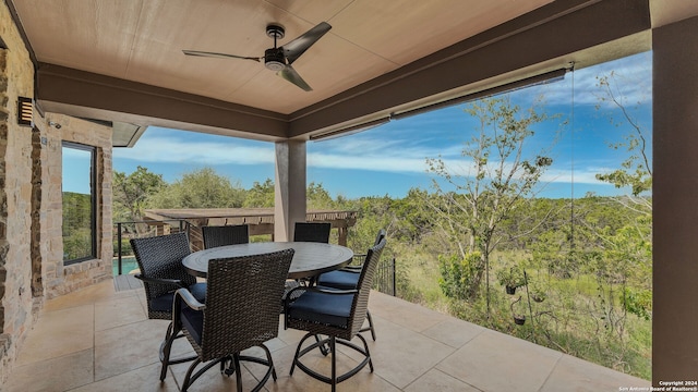 view of patio / terrace featuring ceiling fan