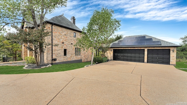 view of home's exterior with solar panels