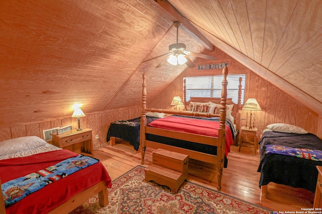 1177 River Rd, Concan, TX 78801 - bedroom with wood ceiling, wooden walls, wood-type flooring, lofted ceiling, and a ceiling fan