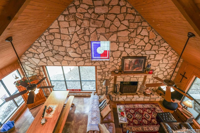 1177 River Rd, Concan, TX 78801 - unfurnished living room with wood ceiling, ceiling fan, high vaulted ceiling, a fireplace, and wood finished floors