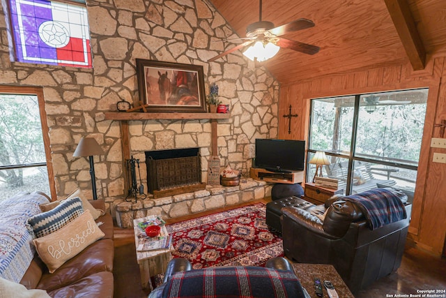 living room with ceiling fan, lofted ceiling with beams, wooden ceiling, and a healthy amount of sunlight