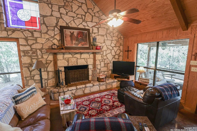 1177 River Rd, Concan, TX 78801 - living area featuring lofted ceiling, healthy amount of natural light, wooden ceiling, a ceiling fan, and a fireplace