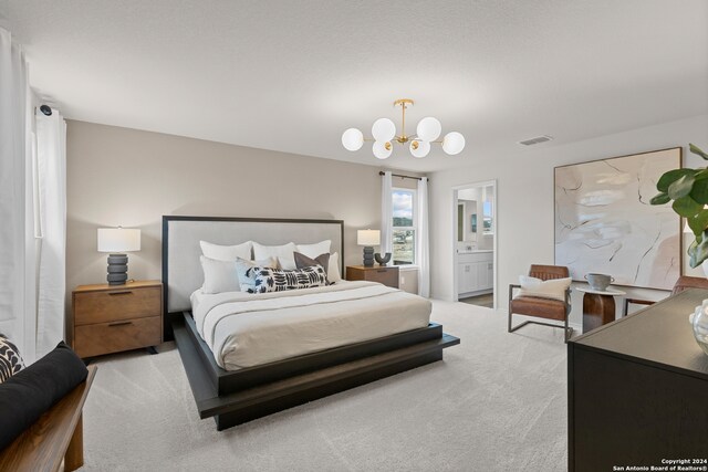 bedroom featuring a notable chandelier, connected bathroom, and carpet flooring