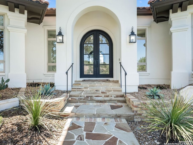 entrance to property featuring french doors