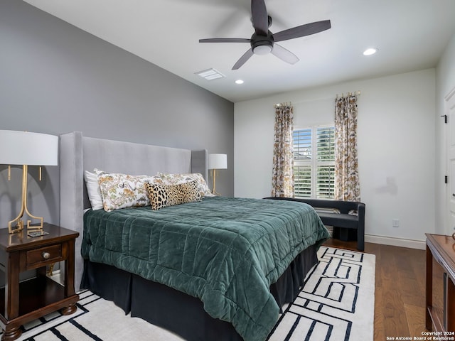 bedroom with ceiling fan and dark hardwood / wood-style floors