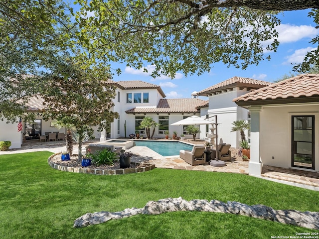 exterior space featuring a yard, a patio, and an outdoor living space