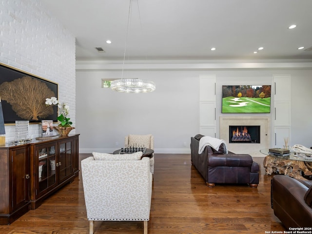 living room featuring dark hardwood / wood-style floors and a chandelier