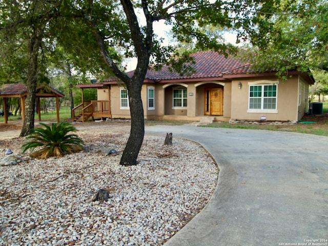 view of front of home with cooling unit