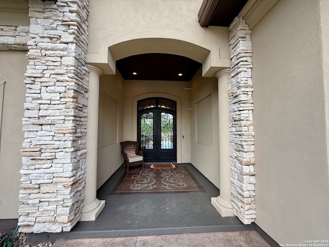 property entrance featuring french doors