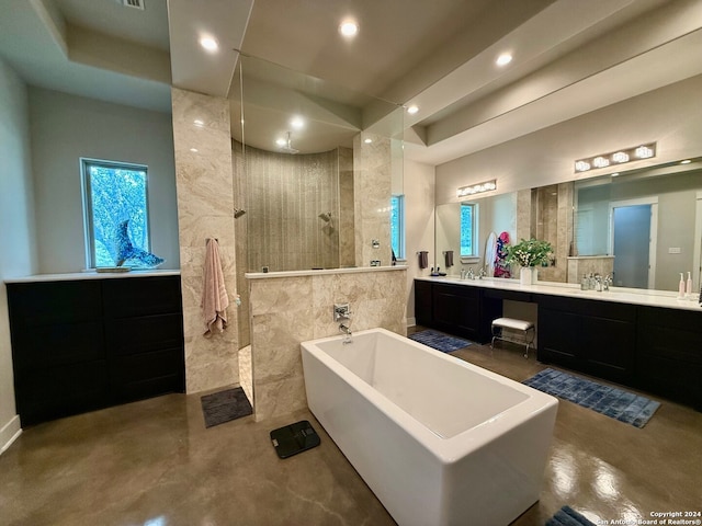 bathroom featuring tile walls, vanity, separate shower and tub, and concrete floors