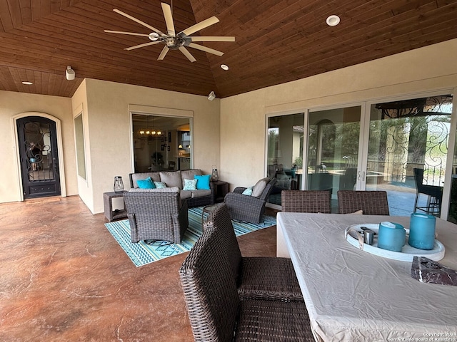 view of patio with an outdoor living space and ceiling fan