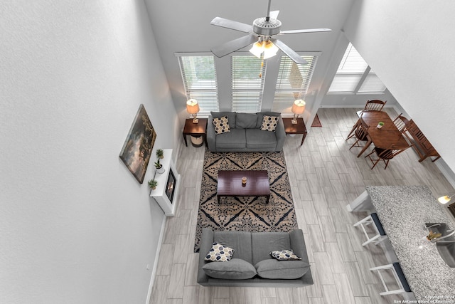 living room featuring hardwood / wood-style flooring and ceiling fan