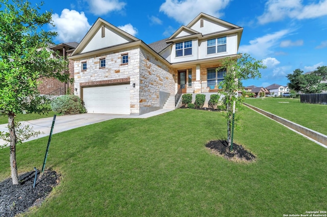 view of front of property with a porch, a garage, and a front yard