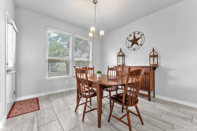 dining room featuring an inviting chandelier and plenty of natural light