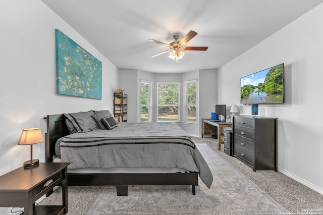 carpeted bedroom featuring ceiling fan