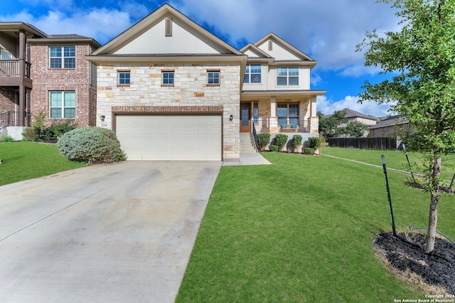 view of front of home featuring a porch, a garage, and a front yard