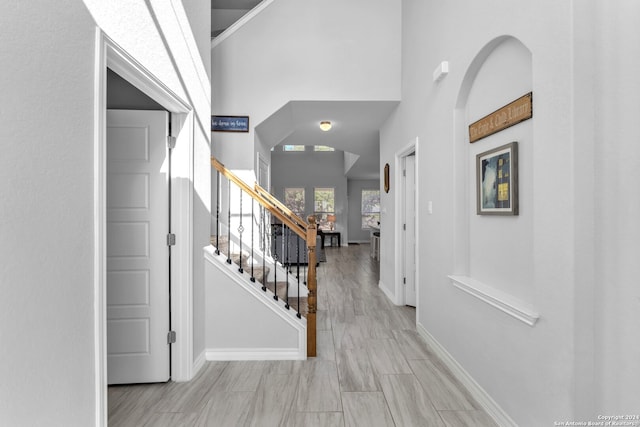 entryway with a towering ceiling