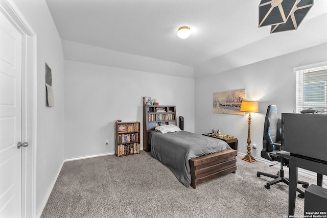 bedroom featuring carpet flooring and lofted ceiling