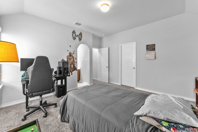 bedroom featuring carpet flooring and lofted ceiling