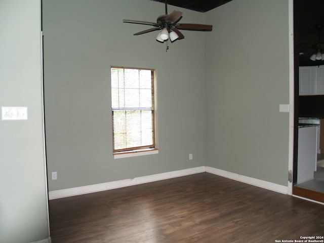 spare room featuring ceiling fan and dark hardwood / wood-style floors