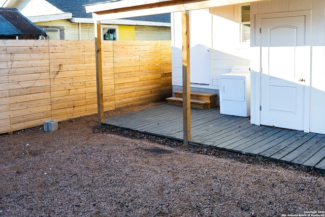 wooden terrace with washer / dryer