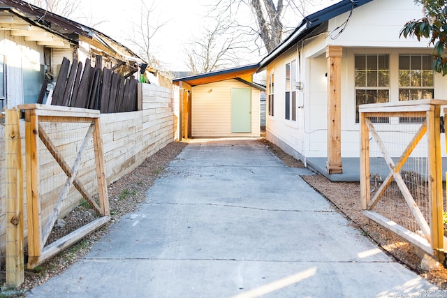 view of side of property featuring a shed