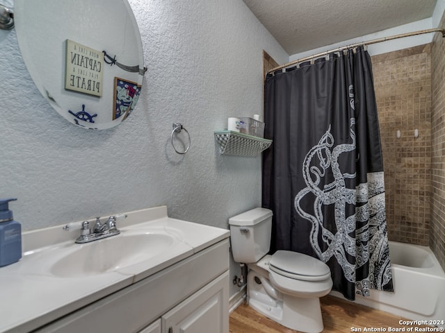 full bathroom featuring shower / tub combo, hardwood / wood-style flooring, vanity, and toilet