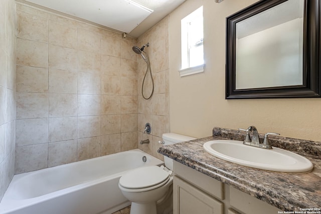 full bathroom with tiled shower / bath combo, vanity, and toilet