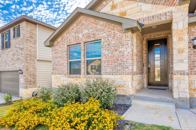 entrance to property featuring a garage