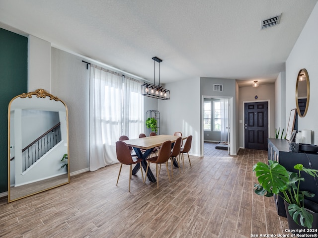 dining area with a textured ceiling