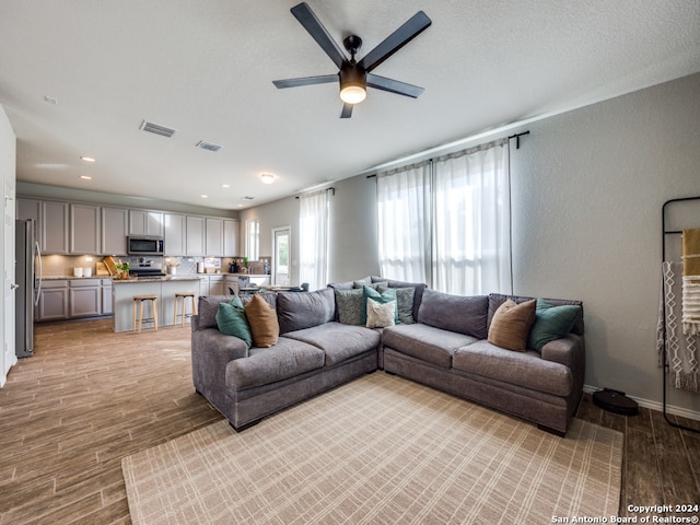 living room with ceiling fan