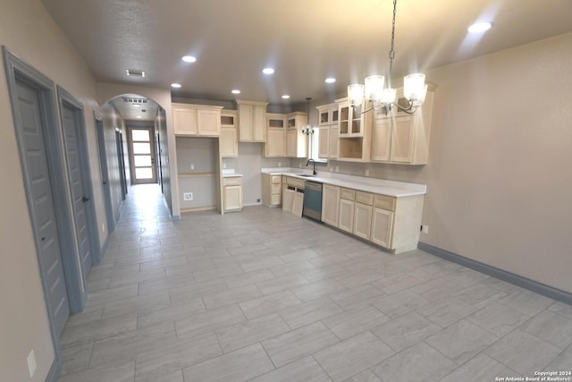 kitchen with a notable chandelier, hanging light fixtures, sink, and stainless steel dishwasher